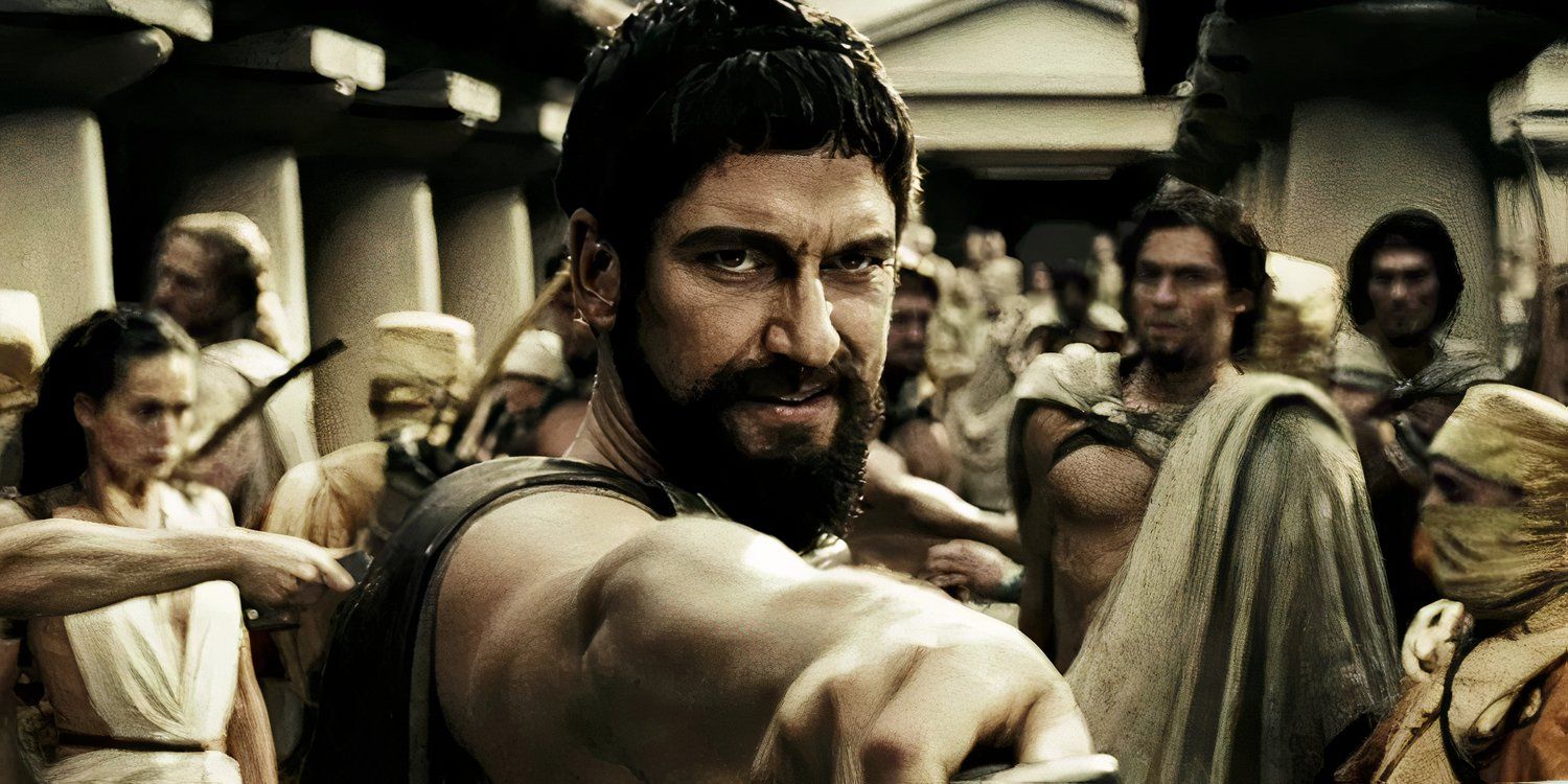 Gerard Butler holds out a sword in 300 