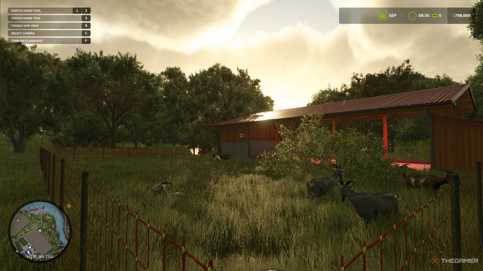 Goats in a barn in Farming Simulator, they are grazing on grass.