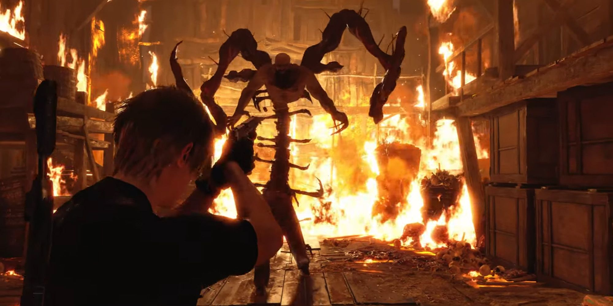 Leon Kennedy aiming a shotgun at Bitores Mendez in a burning barn in Resident Evil 4 Remake. 