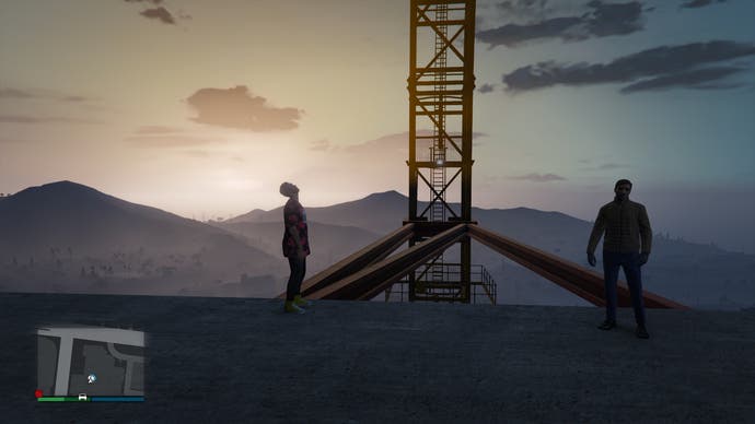 Two actors stand against a dramatic mountain backdrop in Grand Theft Hamlet