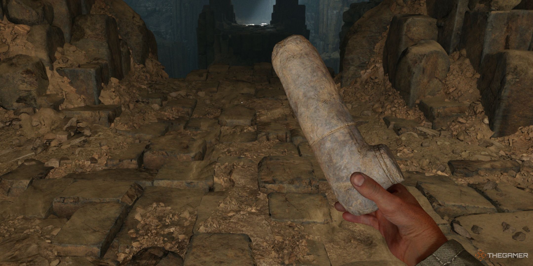 Indy holding an Ancient Relic in the Ancient Caves of Gizeh in Indiana Jones and the Great Circle.