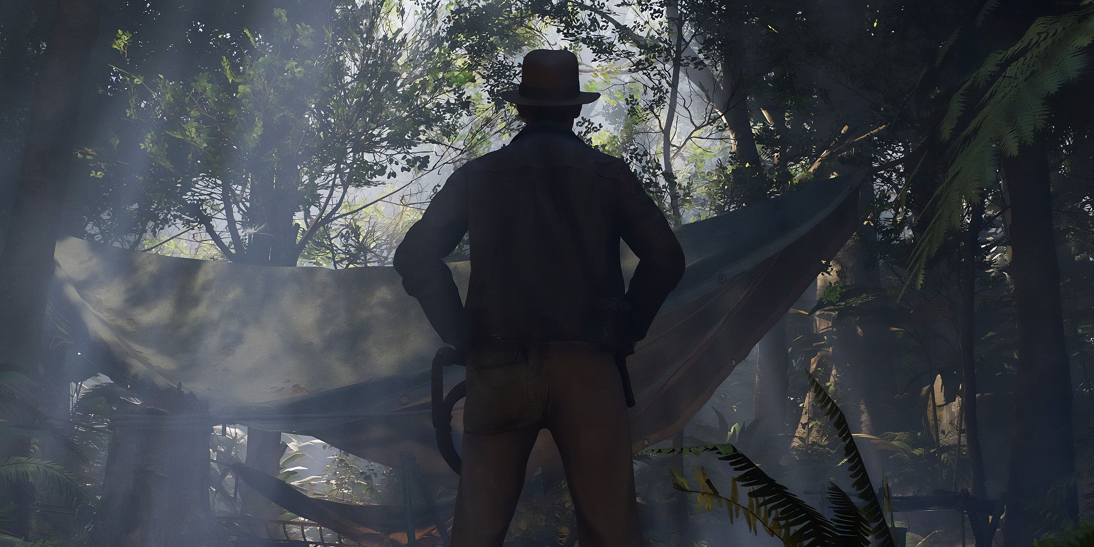 indiana-jones-the-great-circle-game-rant-advance-character-indiana-standing-in-front-of-tent-jungle