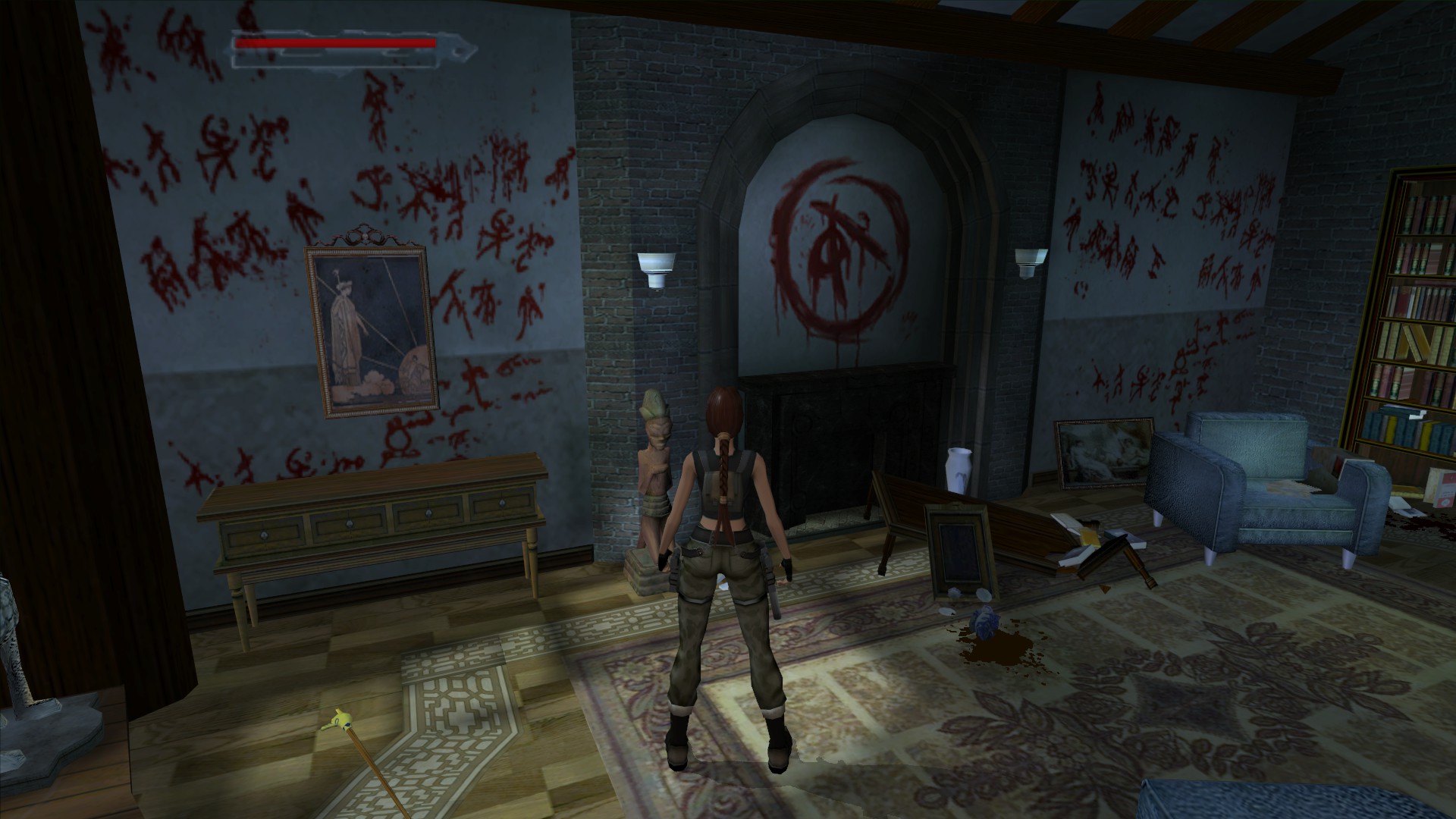 Lara examines strange writing on a wall in Tomb Raider: The Angel of Darkness