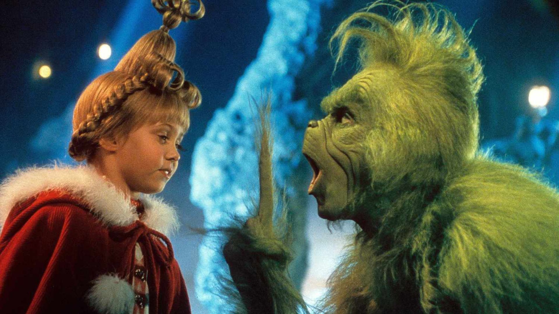 Jim Carrey as the Grinch and Taylor Momsen as Cindy Lou Who during How the Grinch Stole Christmas.