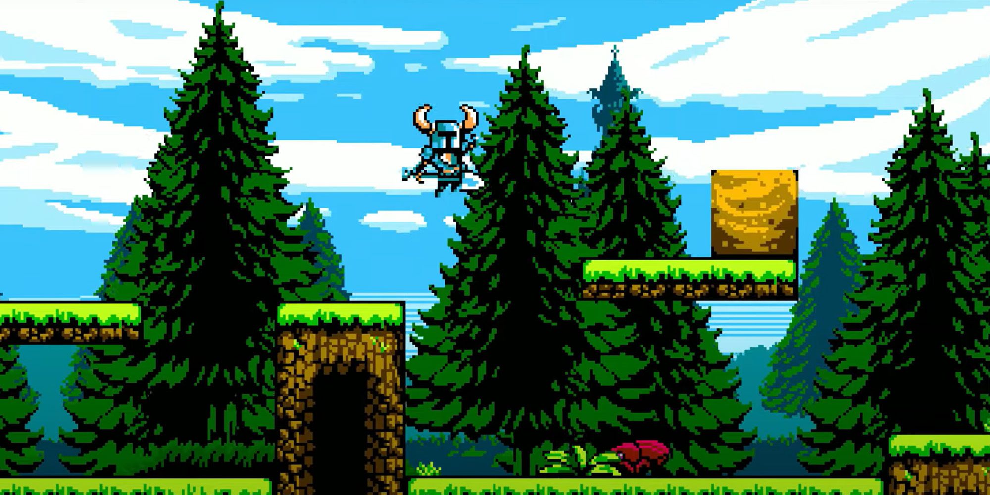 Shovel Knight jumping across a gap in a grass level from Shovel of Hope.