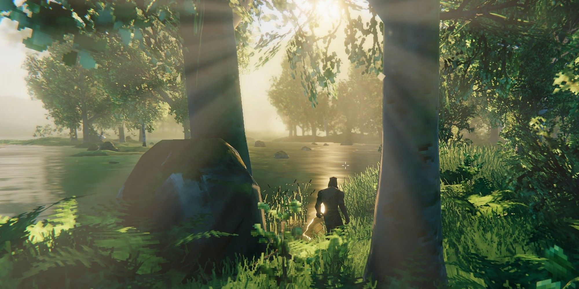 A player in Valheim standing next to a lake in a lush, wooded area.