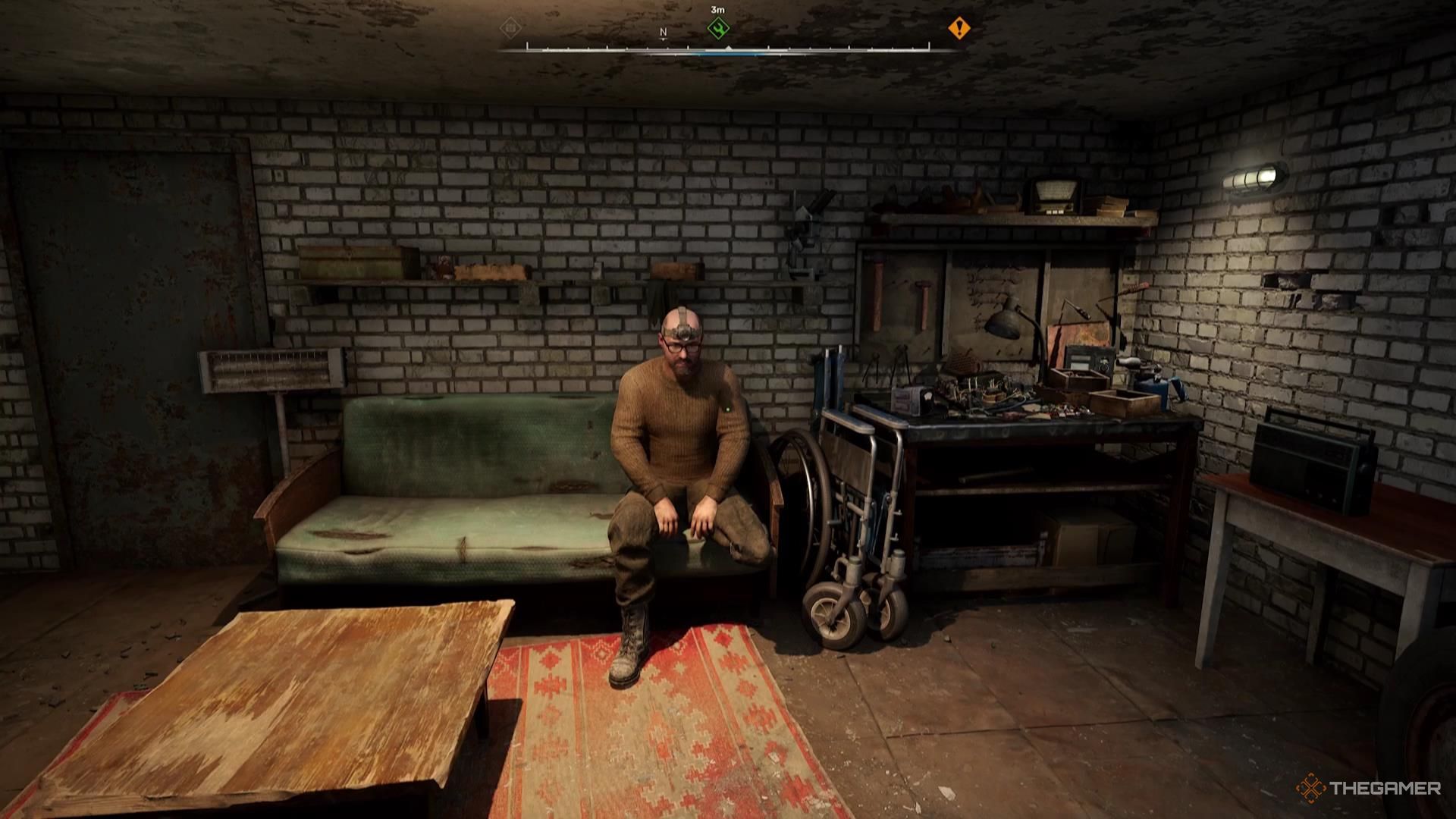 A Tech names Lens sits on his couch in Stalker 2.