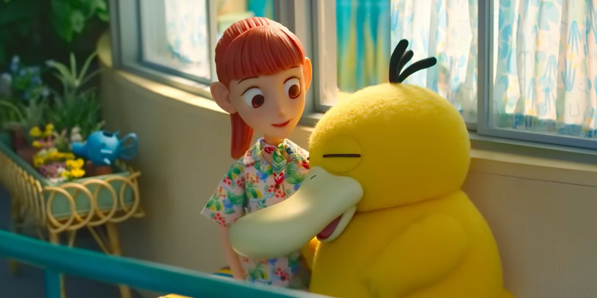 Haru holding a sleeping Psyduck in Pokemon Concierge