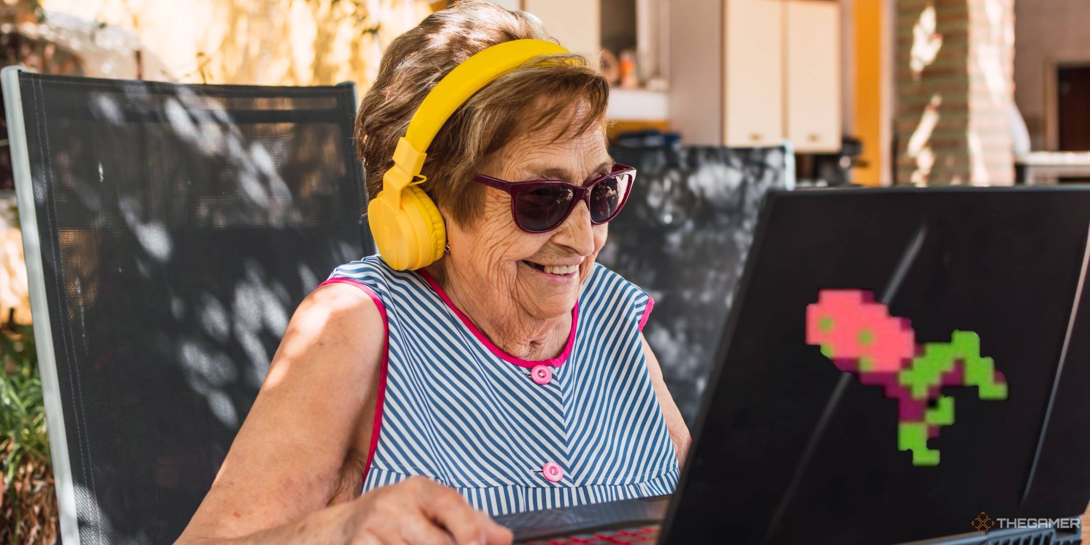 Granny playing a laptop with mooncat on it