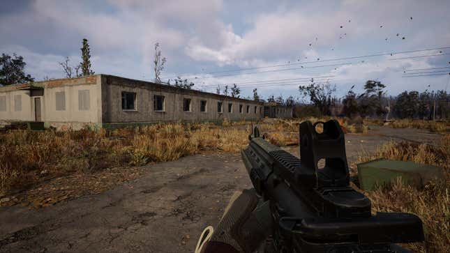 An exterior screenshot of the game shows the military barracks where the Riemann SMG awaits.