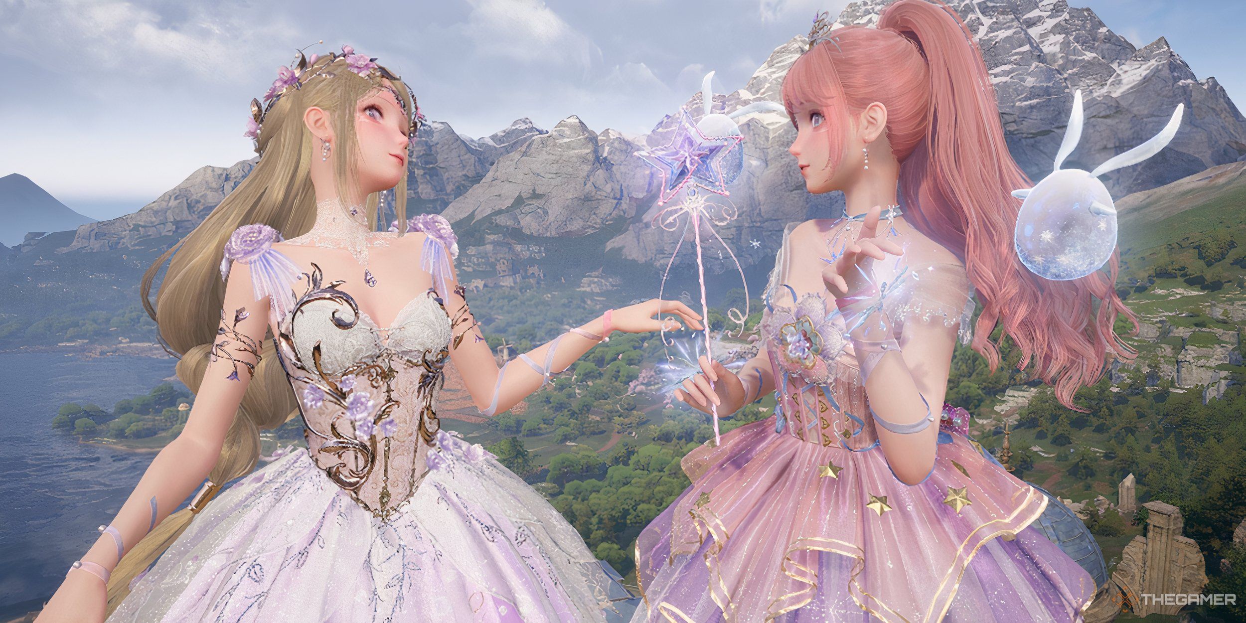 Two Nikkis dressed in frilly, sparkly dresses overlooking a mountain.