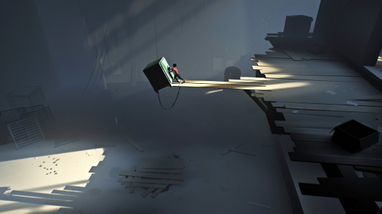 A young boy pushes an enormous safe onto a pit covered by wooden planks in Inside, one of the best platform games.