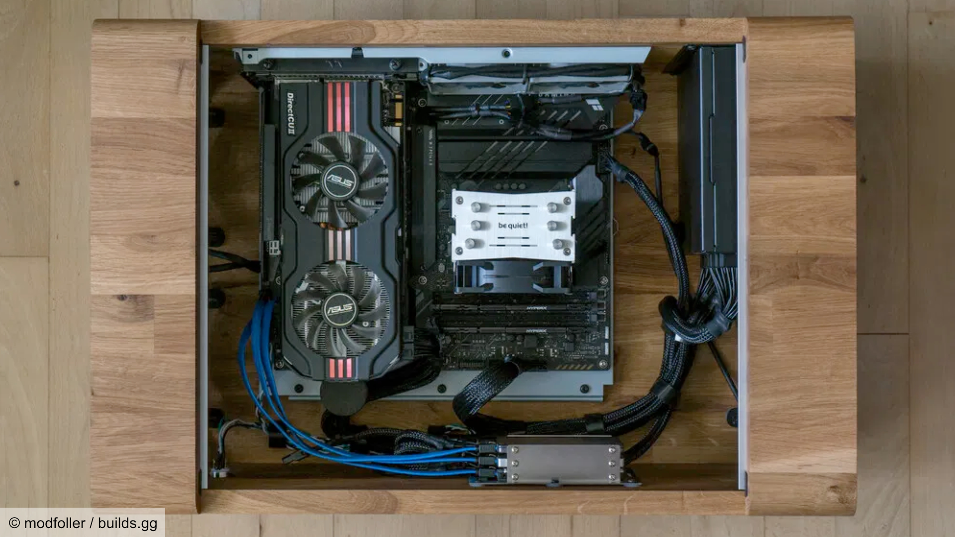 Nordic gaming PC with the top cover removed, showing the motherboard and components.