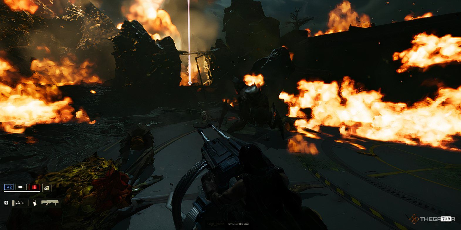 Helldivers 2: A terminid group awash in fire and bullets from Helldivers.