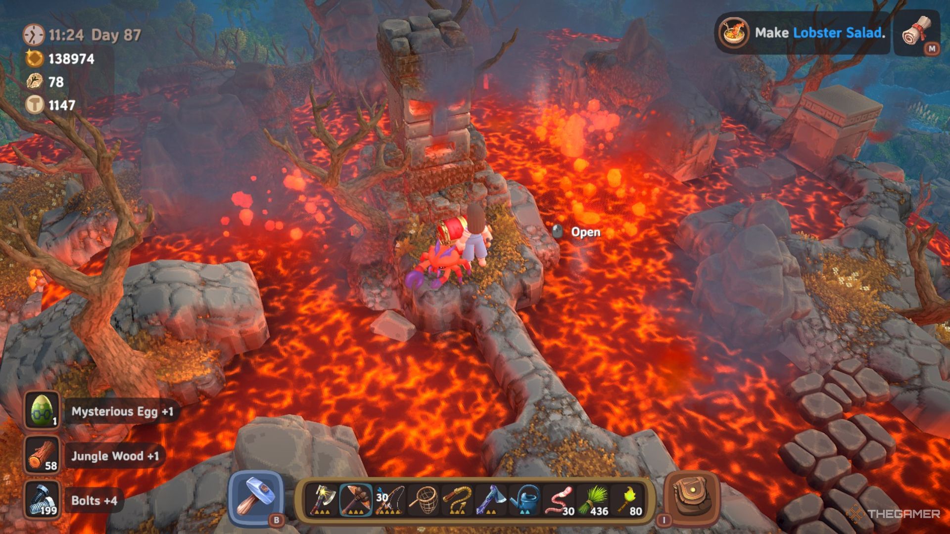 Player character standing by a Red Chest on a tiny island beneath a statue at the summit of a volcano in Luma Island.