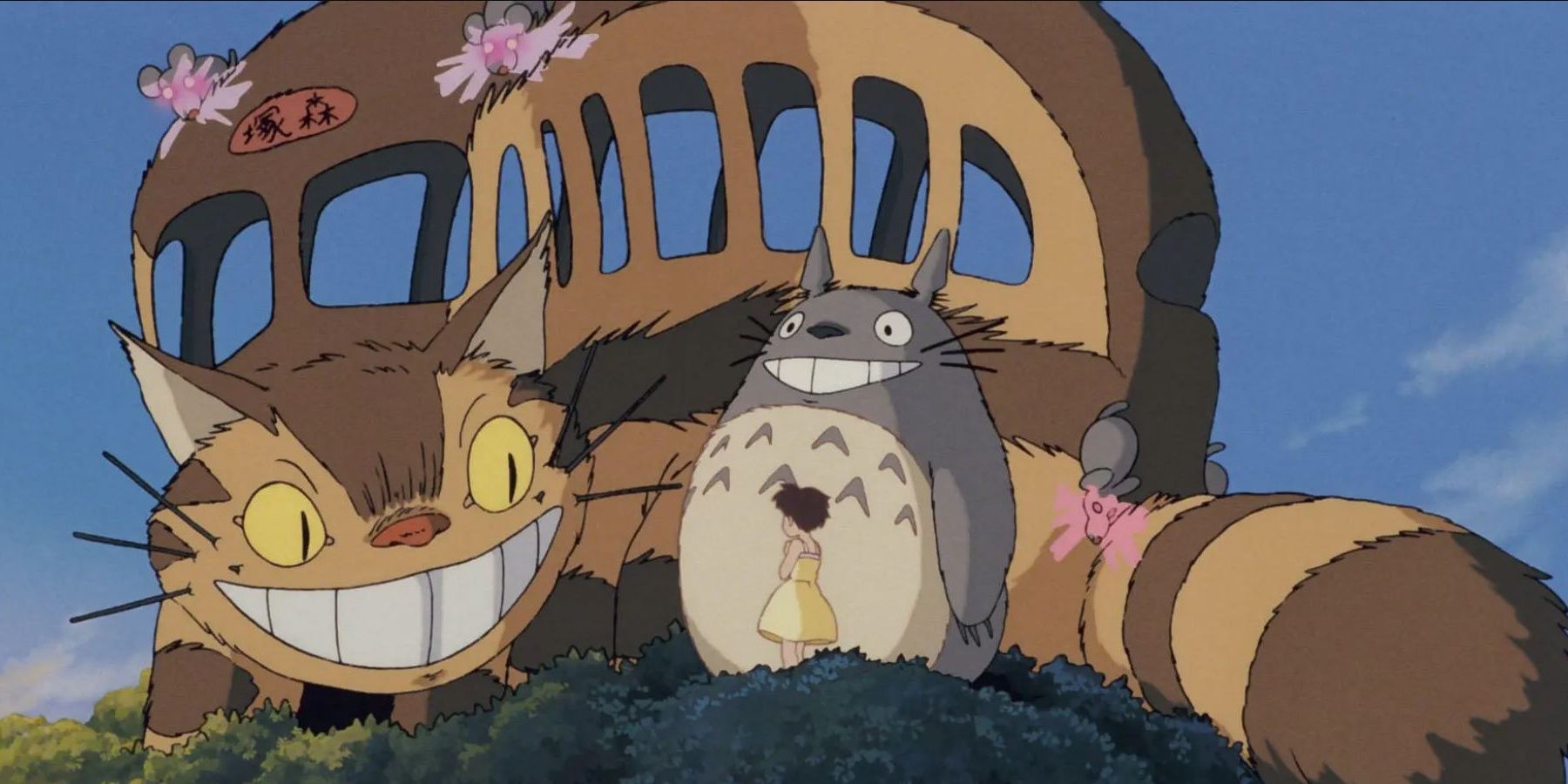 The Catbus, Satsuki, and Totoro standing in a tree