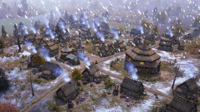 Snow falls over a town in Farthest Frontier