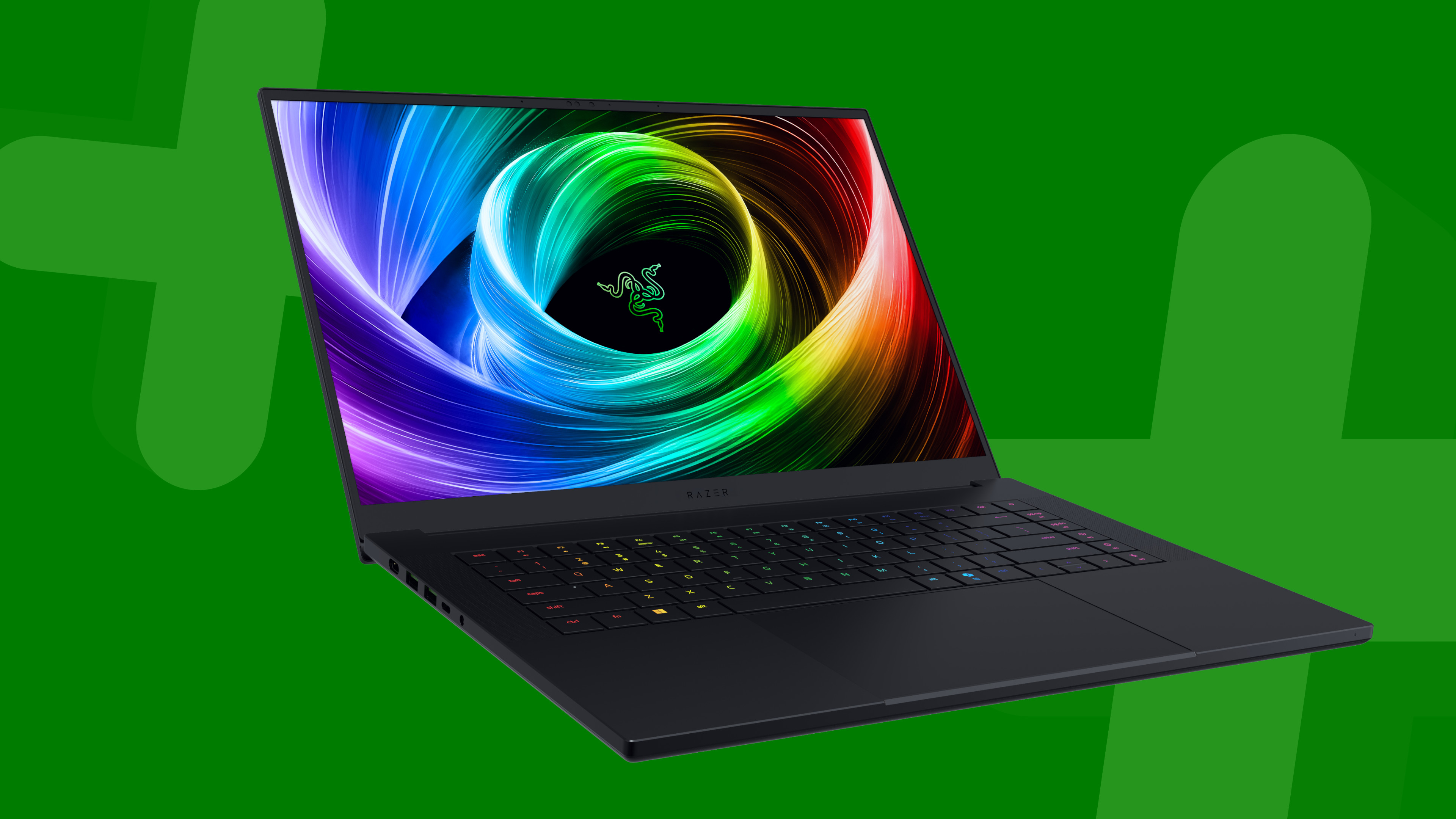 Razer Blade 16 gaming laptop on a green background