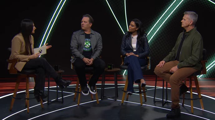 Screenshot from the early 2024 Xbox business update podcast showing Phil Spencer, Sarah Bond, and Matt Booty sitting on stools being interviewed by Xbox's Tina Amini.