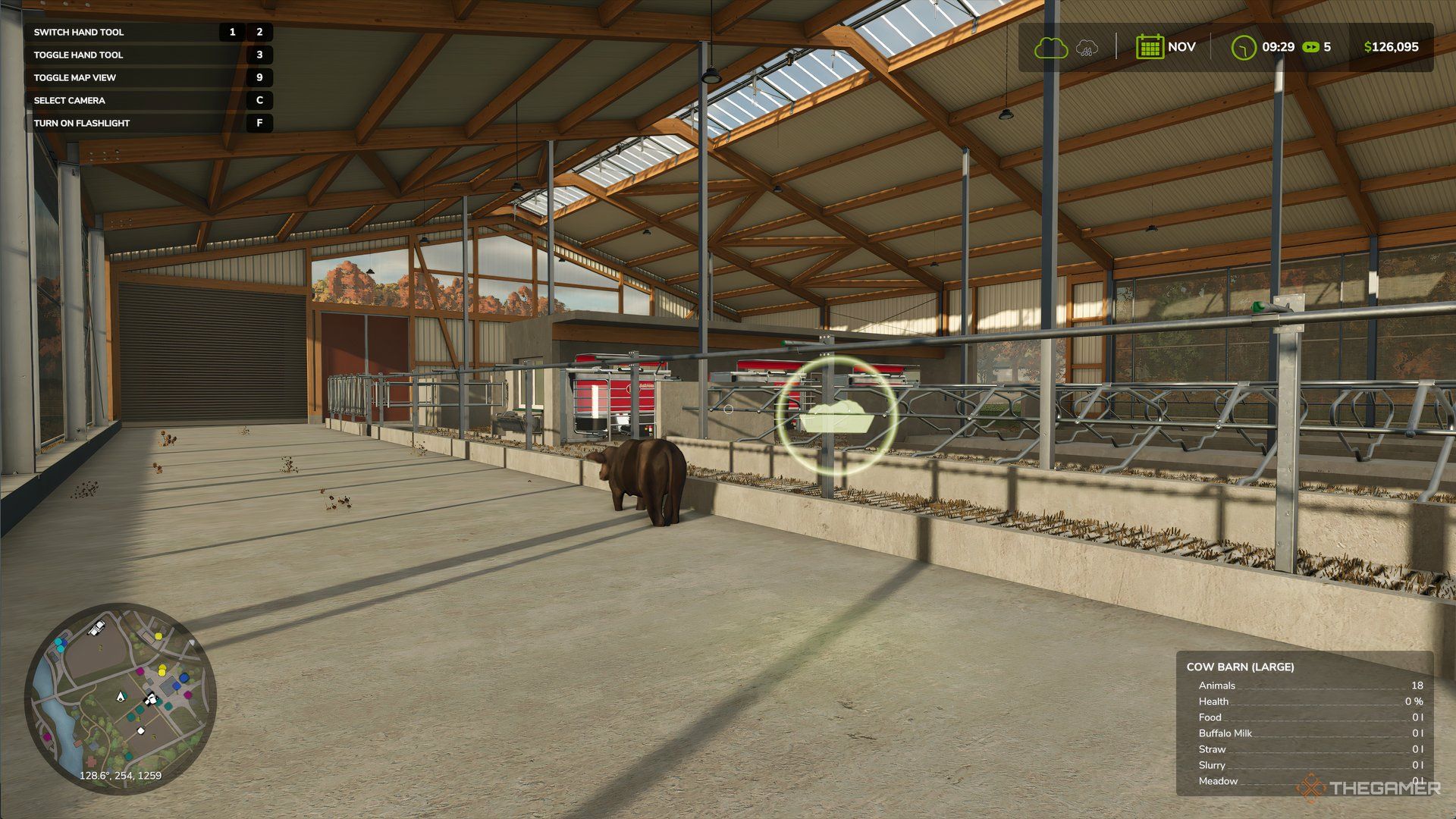 Inside Cow Barn in Farming Simulator 25 with a floating food icon. 