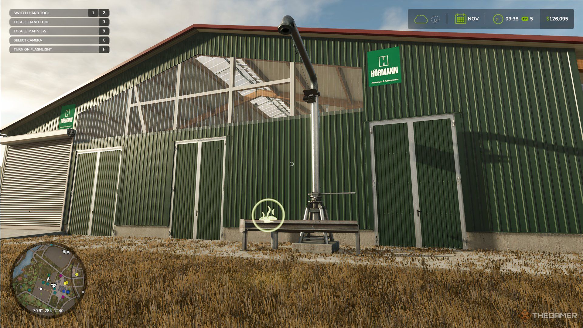 Floating Slurry icon in front of cow barn in Farming Simulator 25.