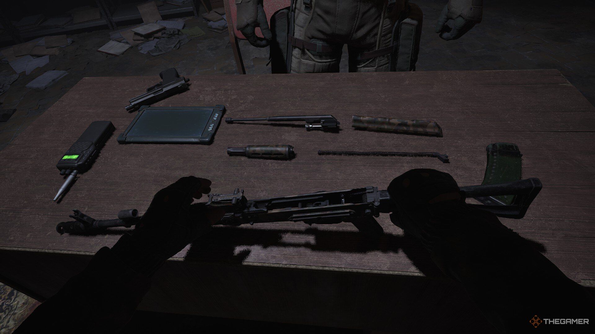 Skif assembles an AKM rifle for the Ward in Stalker 2: Heart Of Chornobyl.