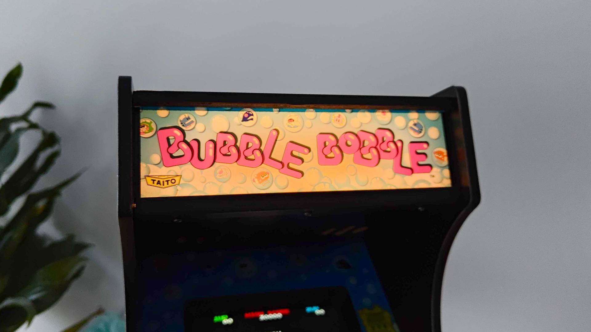 Quartercade Taito Bubble Bobble arcade machine marquee with light on