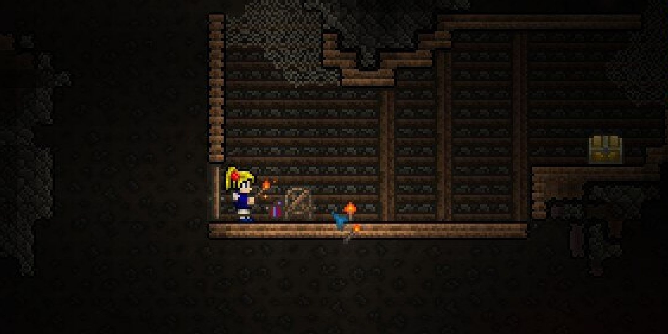 A player looking at an underground loom in Terraria.