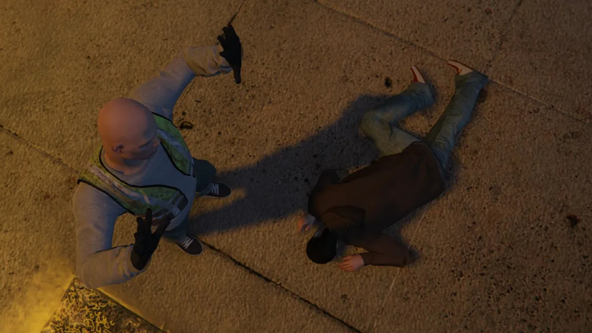 A man in a hi-vis vest standing with his hands raised while a body lies at his feet in GTA 5