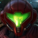 Metroid Prime 4: Beyond screenshot showing Samus' returning Power Armor in detail. A mysterious figure is reflected in her visor