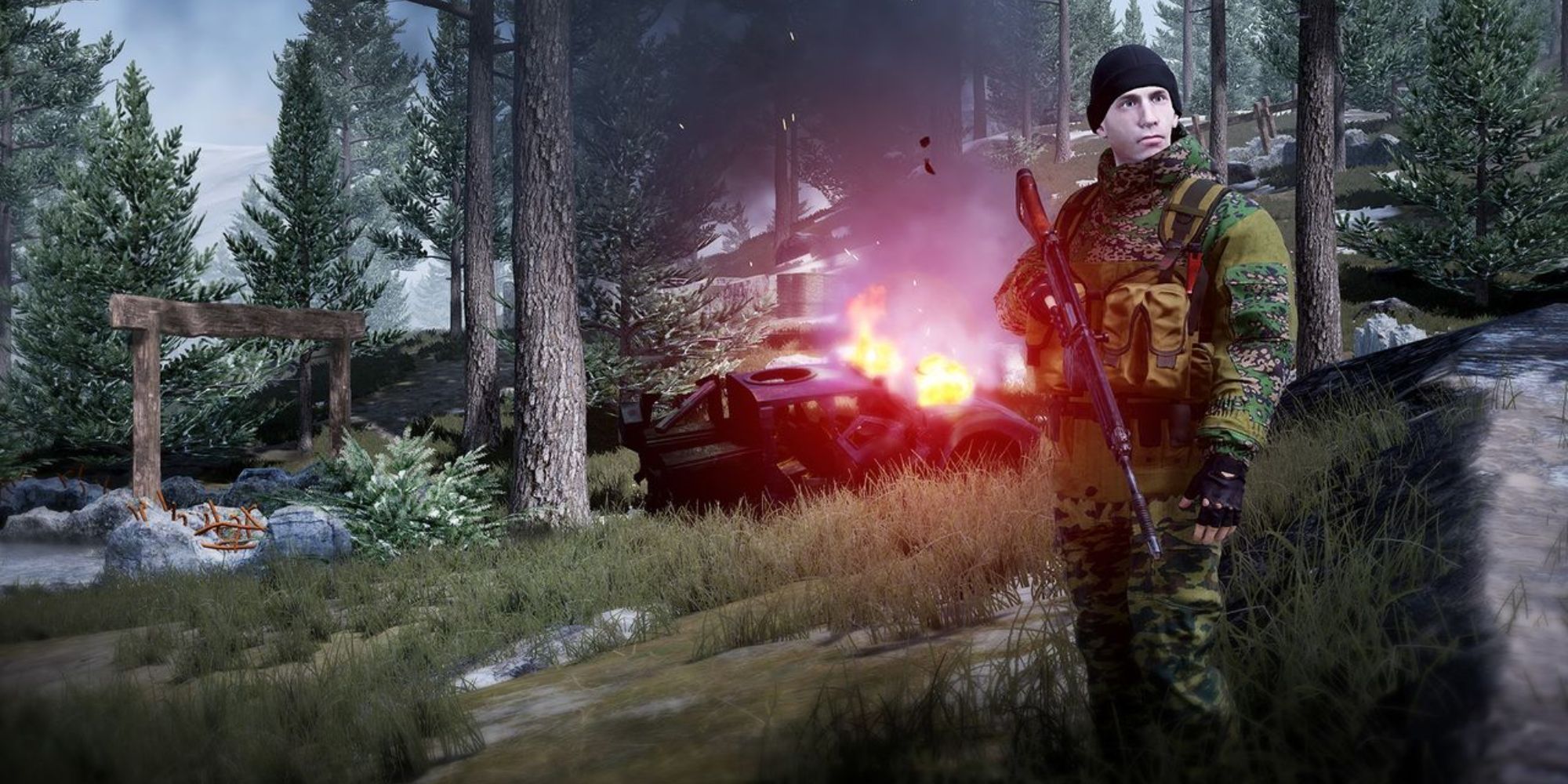 A soldier in Squad staning in front of a burning vehicle in the forest.