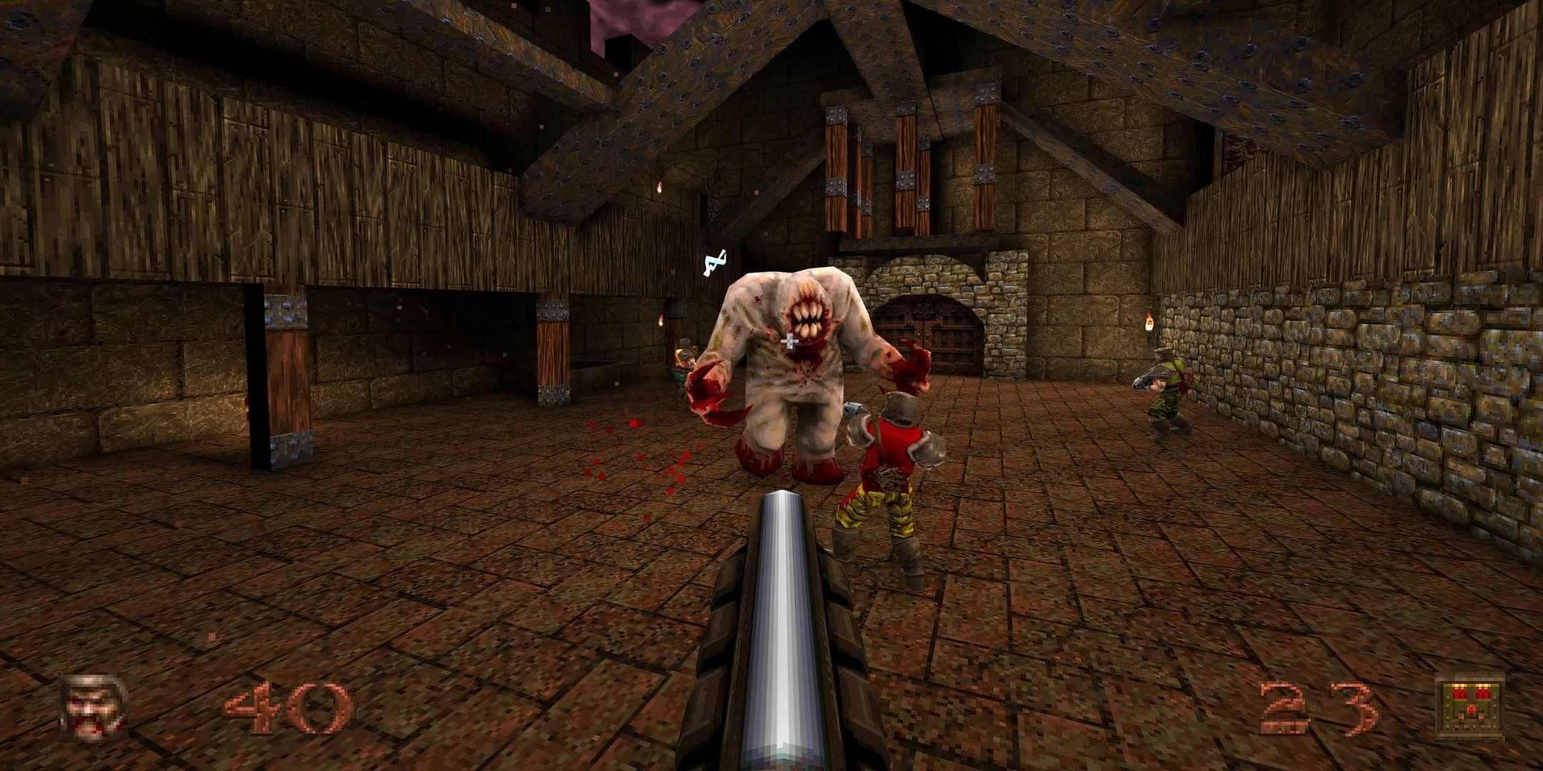 A group of characters fighting a Shambler in Quake.