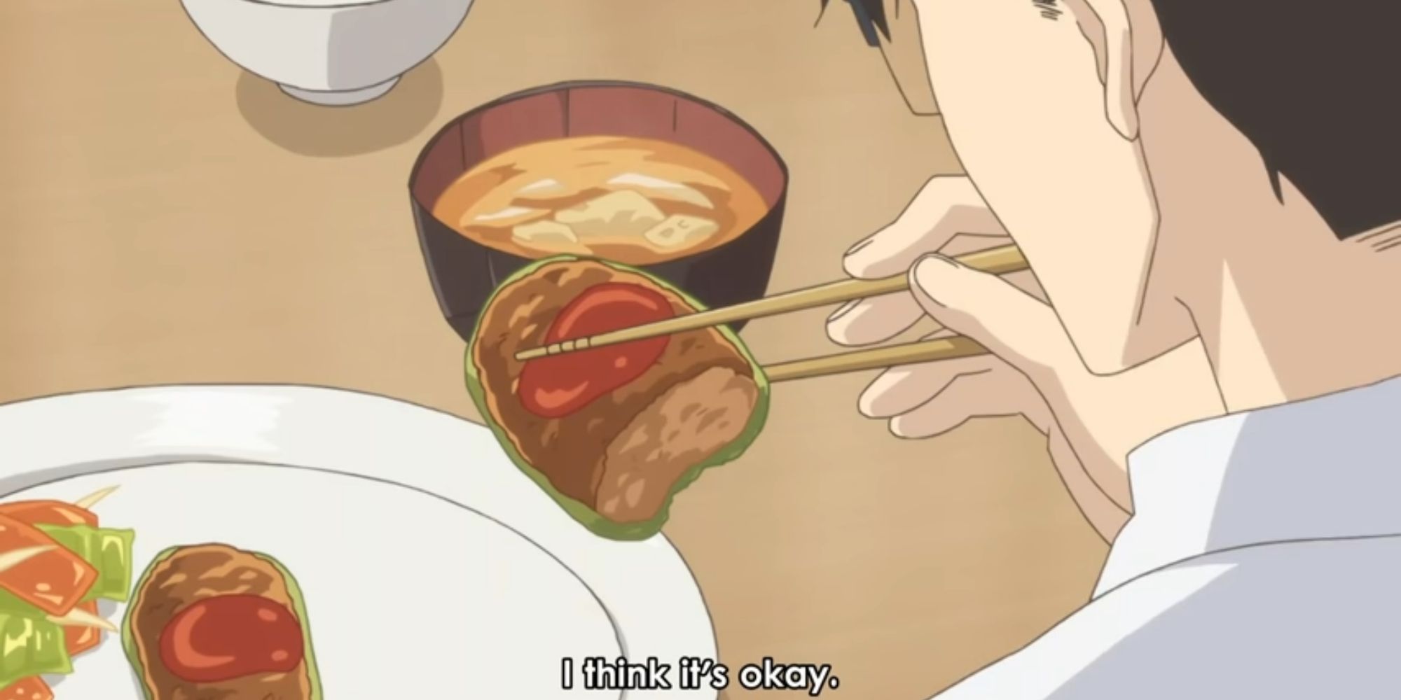 A man using chopsticks to eat in Sweetness & Lightning