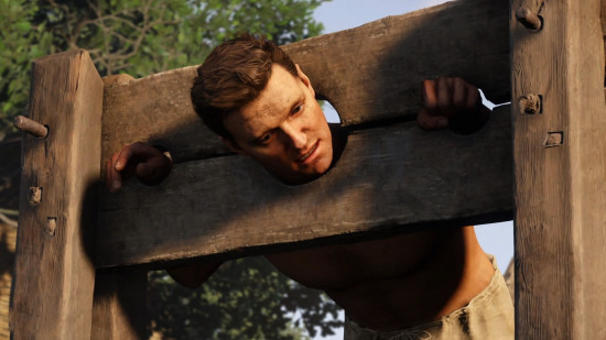 Kingdom Come Deliverance 2 preview: Henry in the stocks.