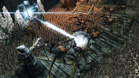 A mage faces a group of spiders in Dark Souls 2.