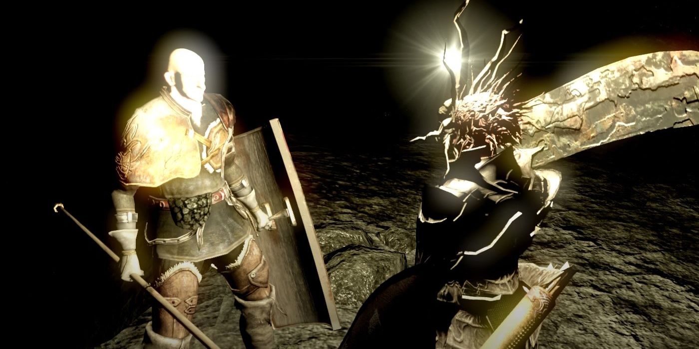 The player interacting with Patches in a dark cave from Dark Souls.