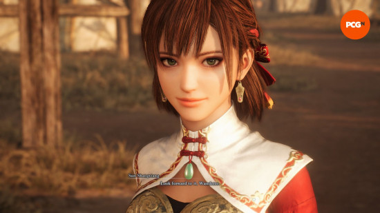 Dynasty Warriors review: a warrior woman with tied back brown hair and a white and red battle garment.