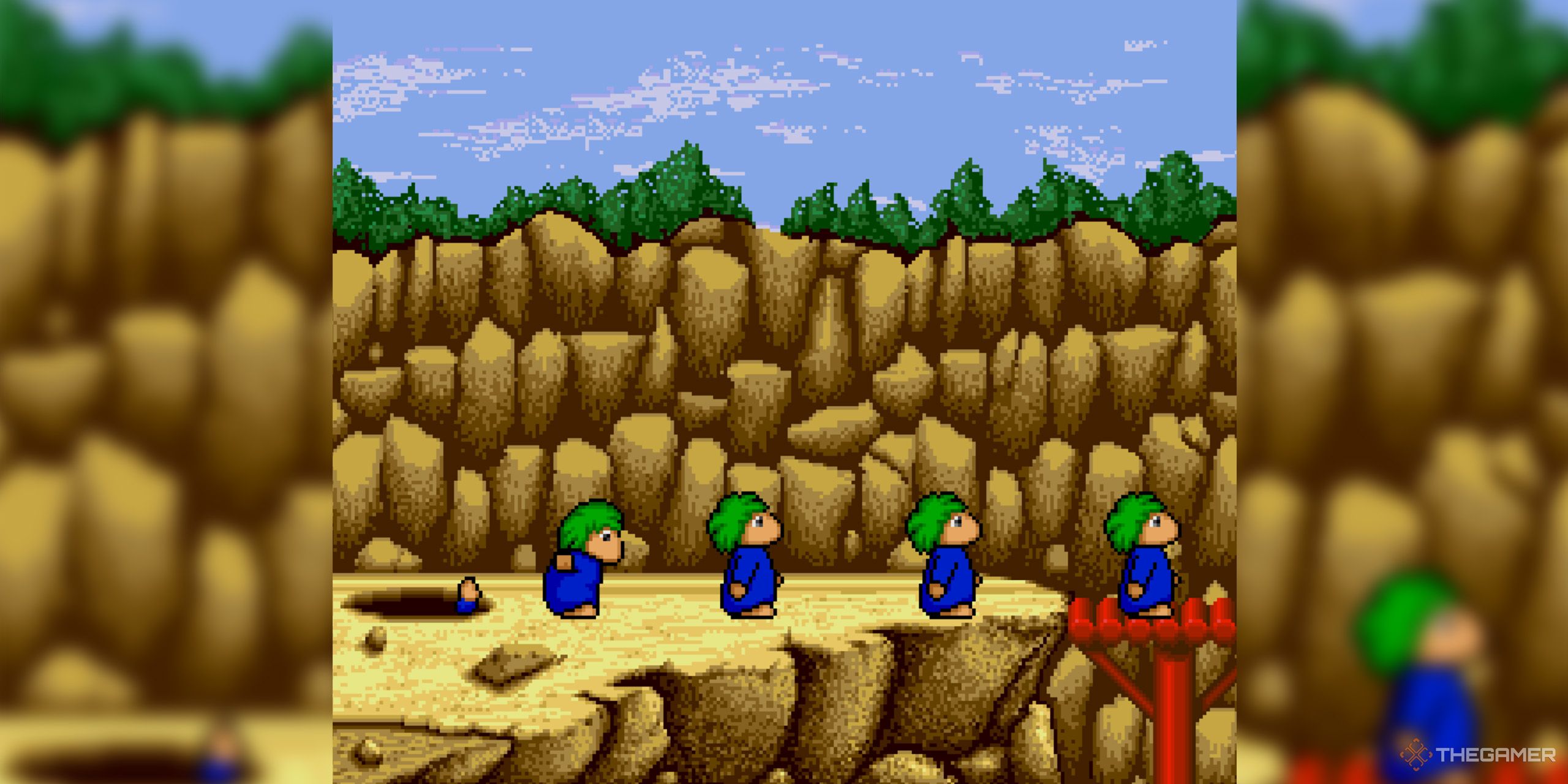 A screenshot from Lemmings, in which four lemmings approach a red bridge in a canyon.