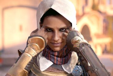 Aya pulling on her hood in Assassin's Creed Origins.