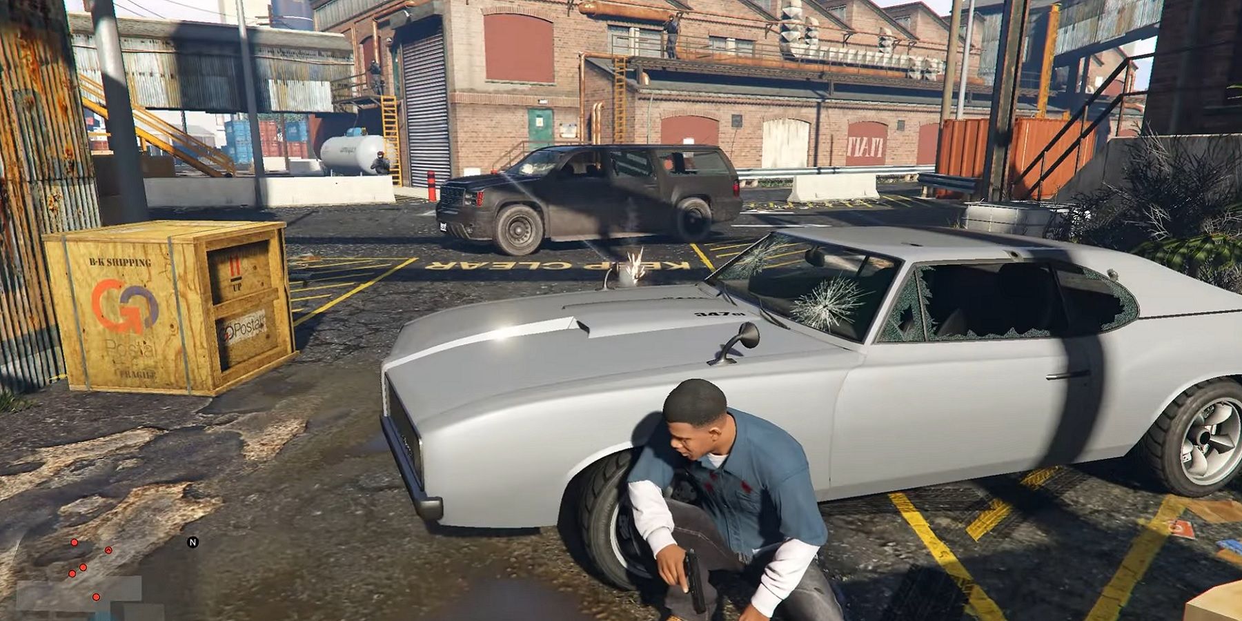 Image from Grand Theft Auto 5 showing Franklin crouched behind a car while being shot at.