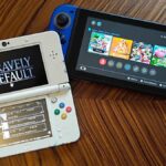 Nintendo Switch next to 3DS with Bravely default title screen displayed on woodgrain table