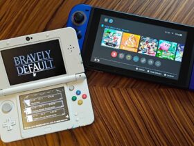 Nintendo Switch next to 3DS with Bravely default title screen displayed on woodgrain table