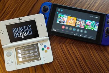 Nintendo Switch next to 3DS with Bravely default title screen displayed on woodgrain table