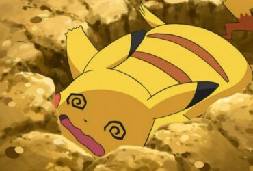 Pikachu fainted, looking worn out on the ground in the Pokemon anime.