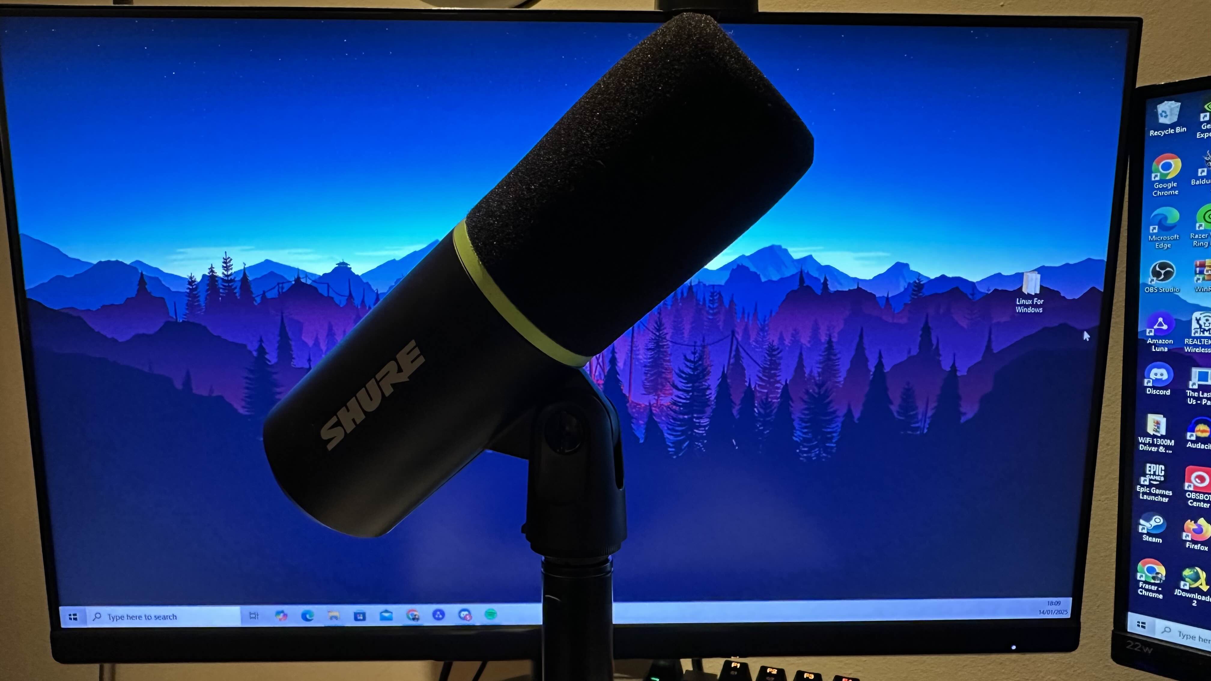 A Shure MV6 review image of the mic in front of a gaming monitor