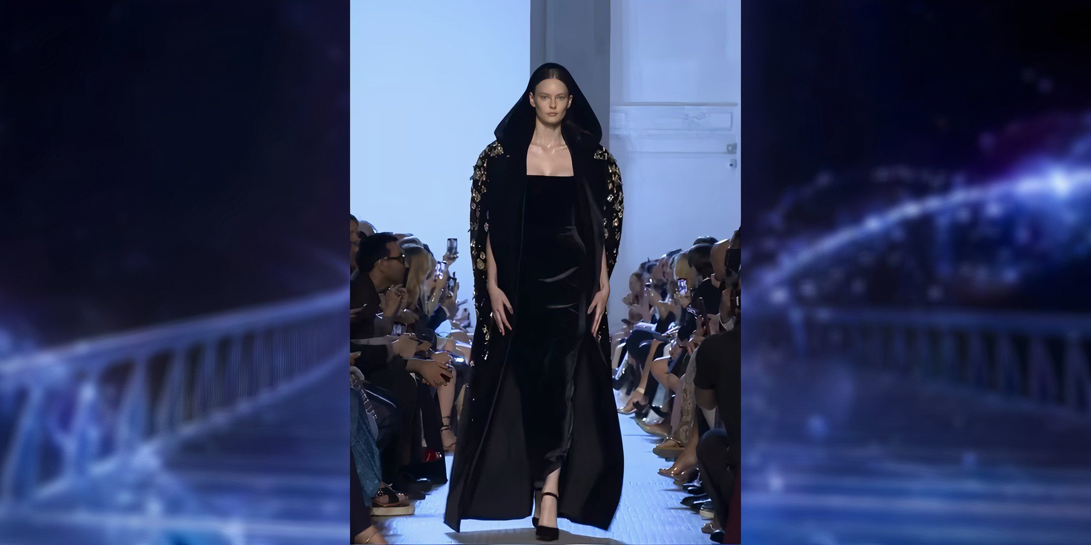 A front and back view of this a hauntingly beautiful black dress with hood. The hood reaches down to the floor and is covered in golden jeweled drops.