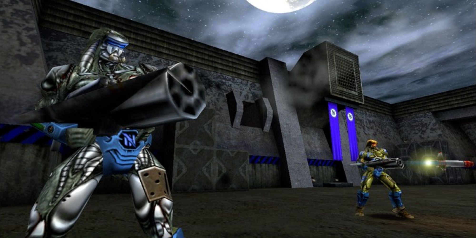 90s FPS a wide shot from the game Unreal Tournament of two Dominators firing various weapons at enemies off screen against a dark and gloomy backdrop of an industrial building.