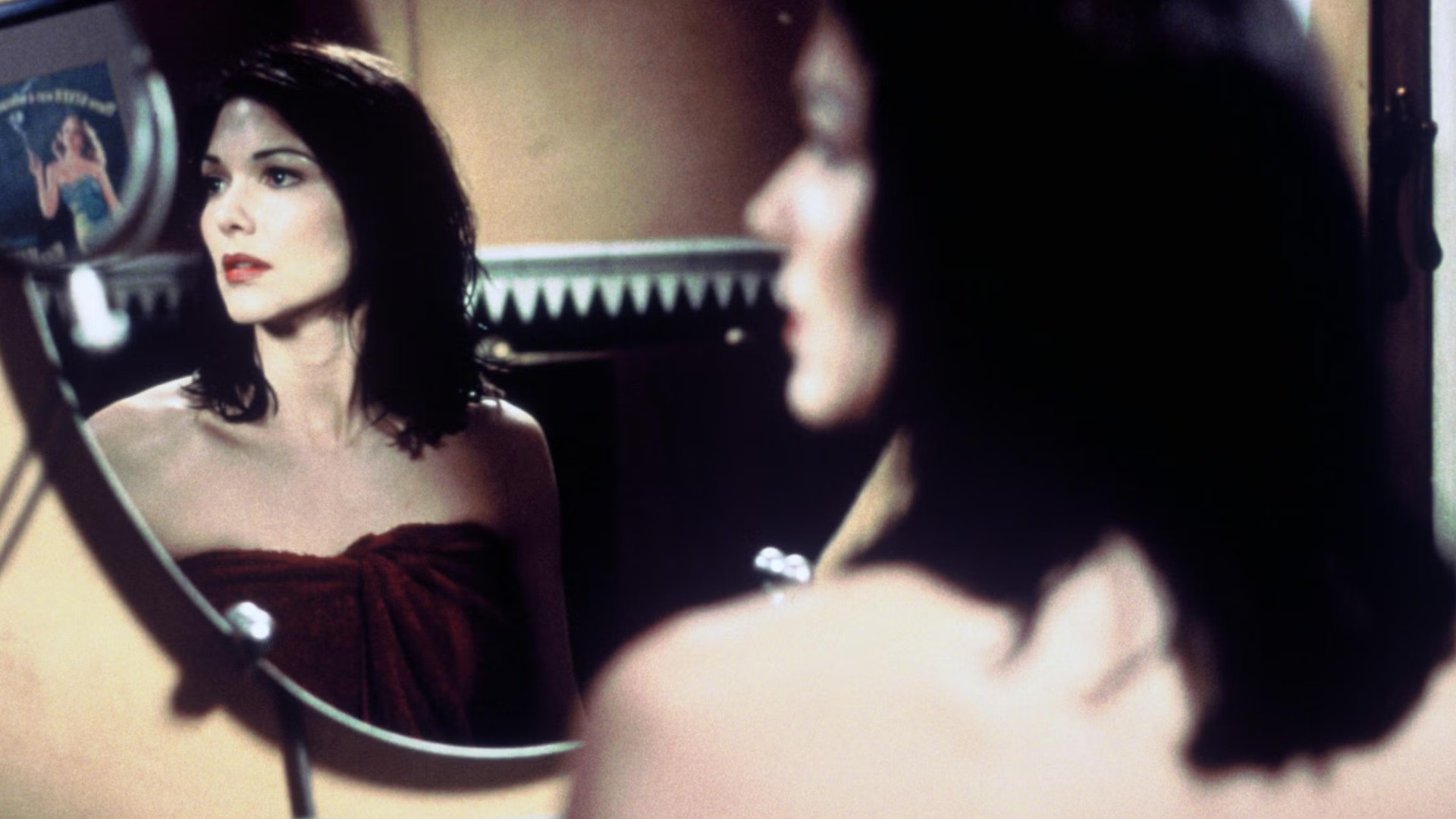 Laura Harring as Rita looking into a mirror during one of the best David Lynch movies, Mulholland Drive.