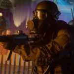 A player wearing a gasmask and holding a gun during the shooter, Call of Duty: Black Ops 6.