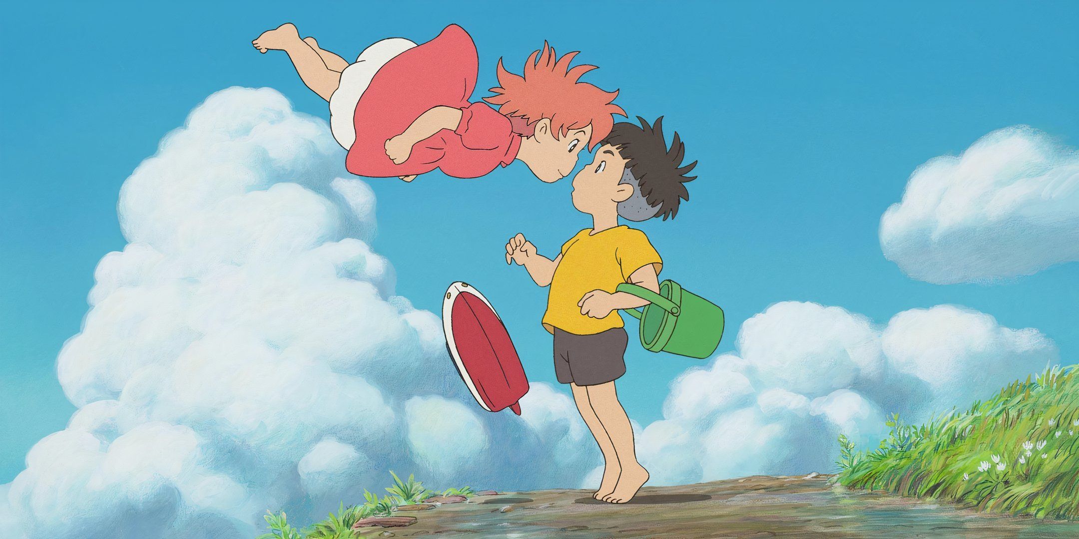 Ponyo floats above Sosuke on a cliff with white, puffy clouds in the background.